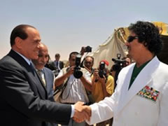 Berluskoni i trembur nga Gedafi: Kerkon te me marre jeten